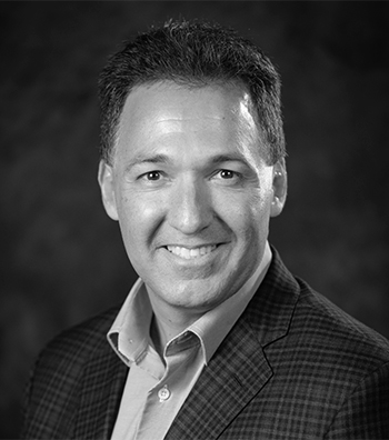 black and white professional headshot of a man